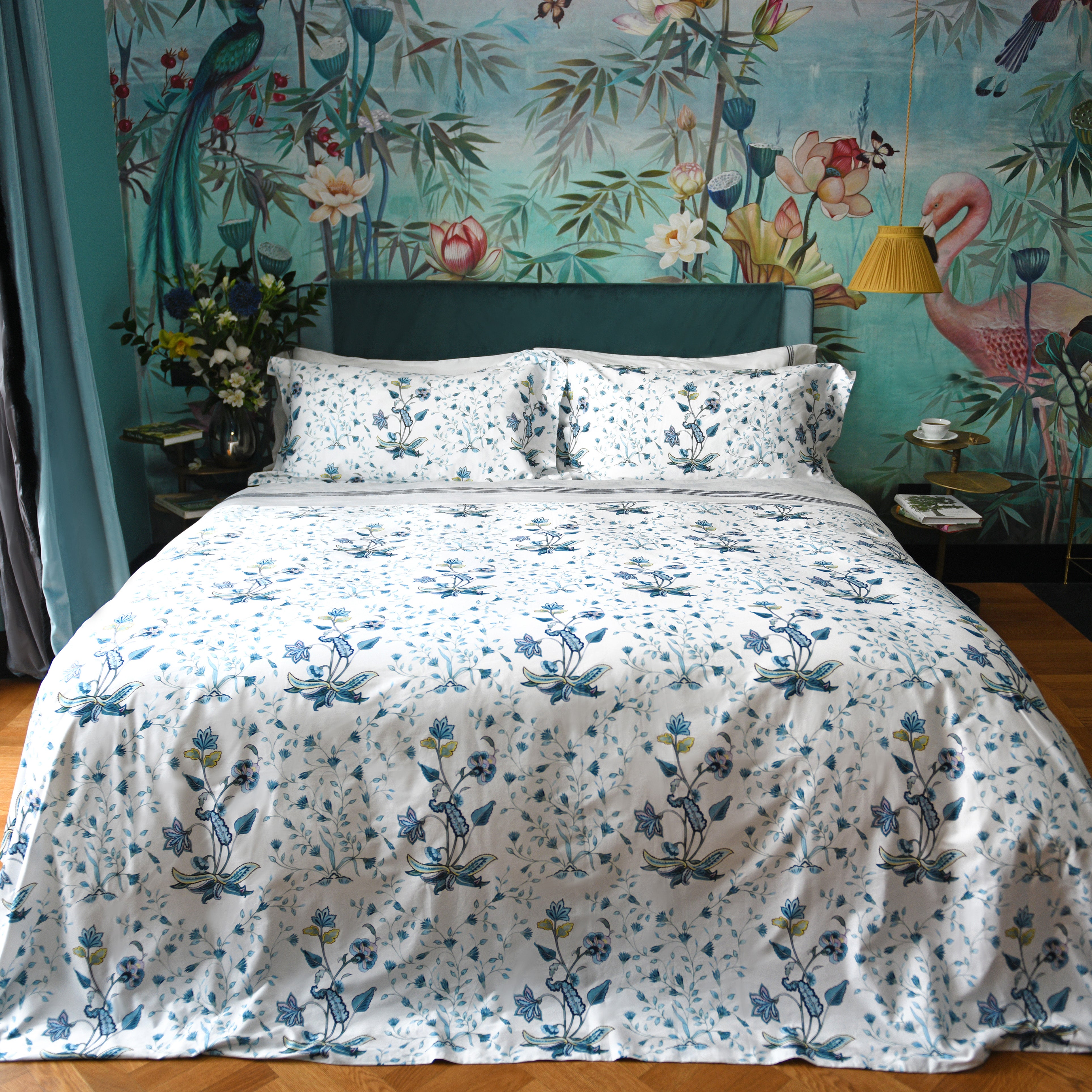White cotton duvet cover set with blue floral print in vibrant botanical bedroom, Fiori design by Villa Cotton