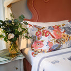 Close-up of pillow sham from Villaggio set with multicolored floral print on soft white cotton