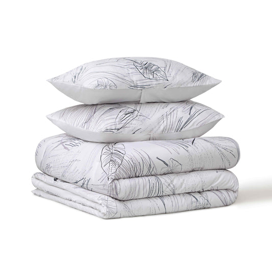 Set of pillow covers and comforters folded and stacked on themselves
