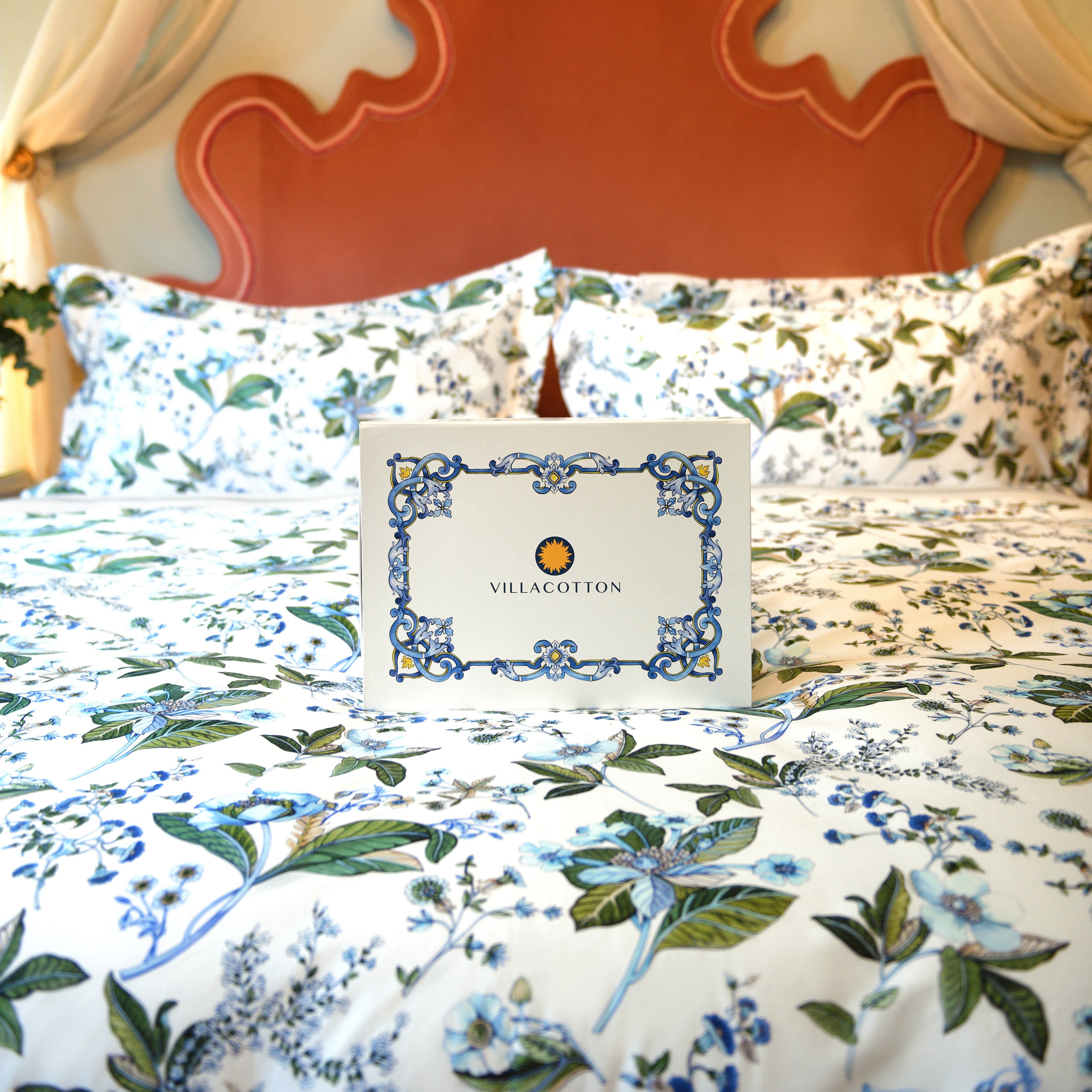 Fantasia printed duvet cover set styled in vintage bedroom with floral bouquets and soft lighting