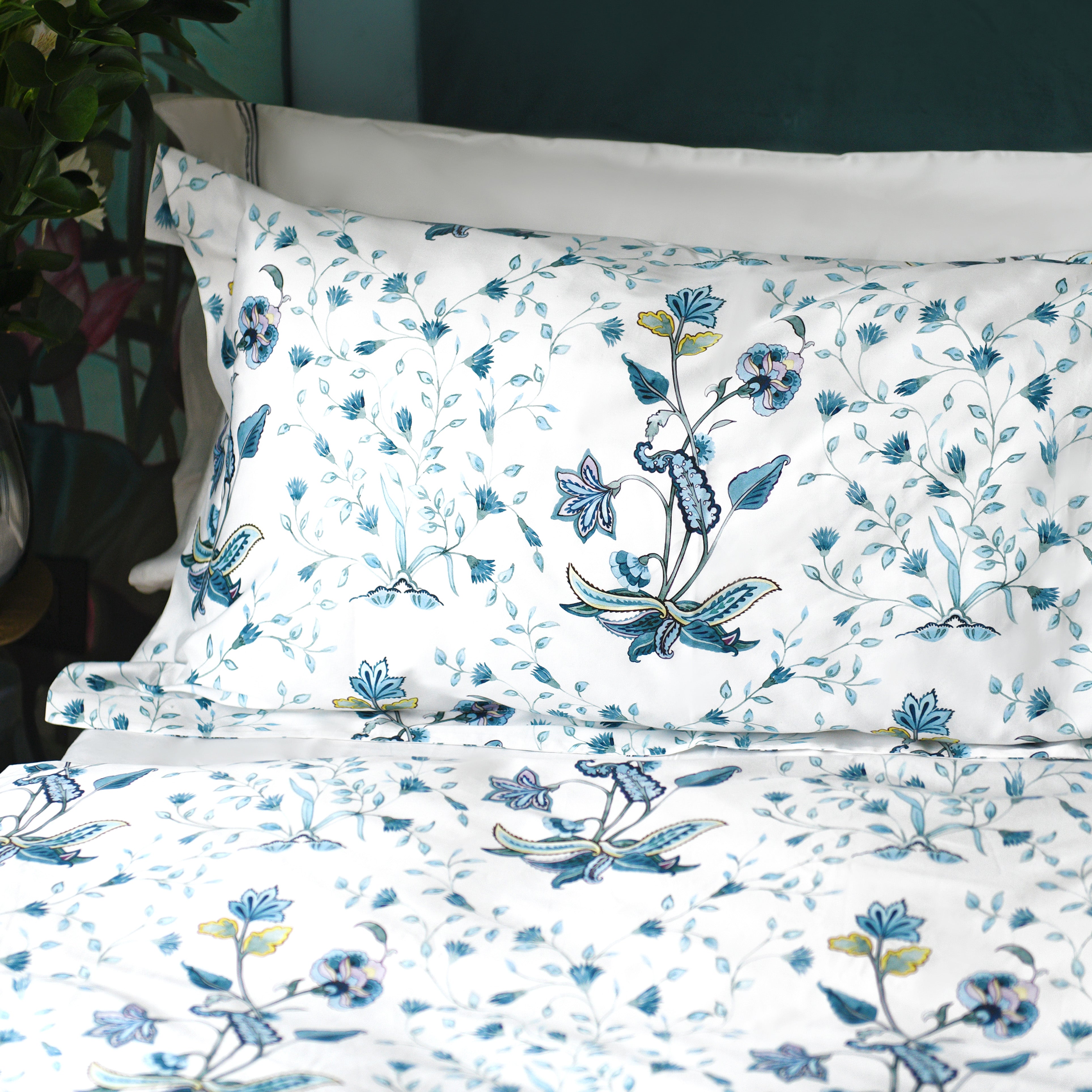Close-up of printed blue floral pattern on pillowcases from Fiori cotton bedding set