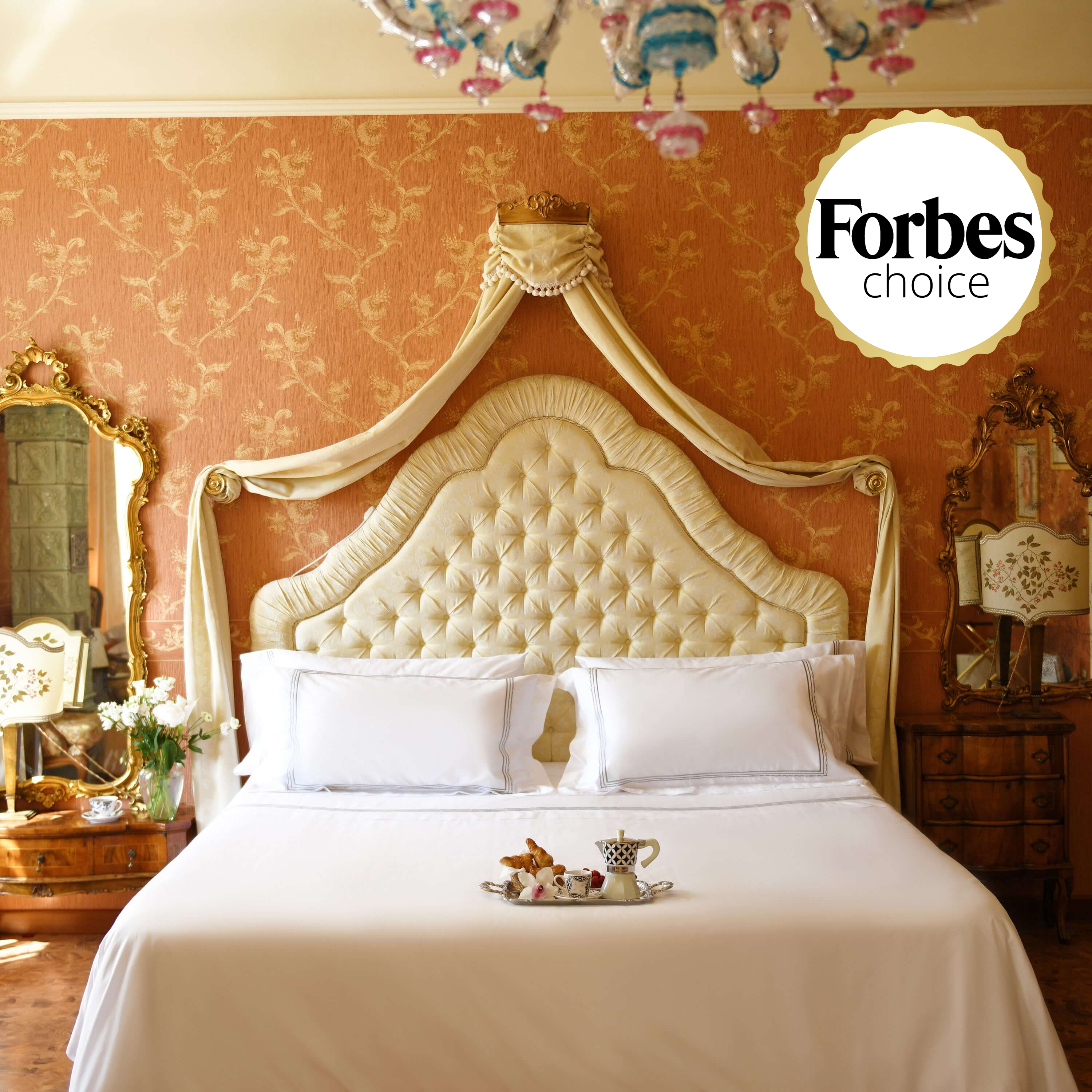 Luxurious white duvet cover set with silver embroidery in opulent bedroom setting, endorsed by Forbes