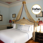 Luxury navy embroidered duvet set by Villa Cotton in Forbes-rated royal bedroom, styled with long-staple cotton and Italian elegance